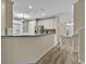 Open kitchen concept with breakfast bar, stainless steel appliances and modern finishes at 1056 Royal Saint George Dr, Orlando, FL 32828