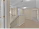 Second floor landing area at the top of the stairs with neutral walls and carpeting at 1056 Royal Saint George Dr, Orlando, FL 32828