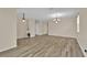 Spacious living area with modern light fixtures and contemporary flooring at 1056 Royal Saint George Dr, Orlando, FL 32828