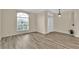 Open living room features neutral walls, light gray floors, and lots of natural light at 1056 Royal Saint George Dr, Orlando, FL 32828