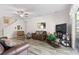 Open living room area featuring hardwood flooring, comfortable furniture, and plenty of space at 1056 Royal Saint George Dr, Orlando, FL 32828