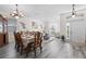 Open-concept design featuring hardwood floors, natural lighting, and stylish furnishings at 1056 Royal Saint George Dr, Orlando, FL 32828