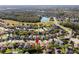 Neighborhood aerial showing the property's location amongst other homes and nearby amenities at 1056 Royal Saint George Dr, Orlando, FL 32828