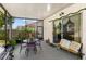 Screened patio featuring an outdoor dining area and grill, perfect for entertaining at 1056 Royal Saint George Dr, Orlando, FL 32828