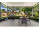Screened patio featuring an outdoor dining area and grill, perfect for entertaining at 1056 Royal Saint George Dr, Orlando, FL 32828