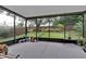 Screened patio featuring an open view of the green backyard at 1056 Royal Saint George Dr, Orlando, FL 32828
