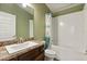 Well-maintained bathroom featuring a single vanity sink, and a shower-tub combination at 2257 Pecos Ct, Kissimmee, FL 34759