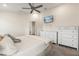 Bright bedroom with a ceiling fan, a TV, and matching dressers at 2257 Pecos Ct, Kissimmee, FL 34759