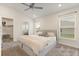 Spacious bedroom featuring a ceiling fan, neutral walls, and plenty of natural light at 2257 Pecos Ct, Kissimmee, FL 34759