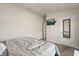 Minimalist bedroom featuring neutral walls, plush carpet, a TV and a mirror at 2257 Pecos Ct, Kissimmee, FL 34759