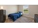 Cozy bedroom with plush carpet, neutral walls, and plenty of natural light at 2257 Pecos Ct, Kissimmee, FL 34759