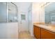 Bathroom featuring glass enclosed shower, vanity with storage, and tile floors at 2637 Shelby Ruth Pl, St Cloud, FL 34769