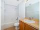 Bathroom featuring a tub-shower combination with tile surround, vanity with sink, and tile flooring at 2637 Shelby Ruth Pl, St Cloud, FL 34769