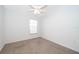 Bedroom featuring neutral walls, carpet flooring, ceiling fan, and natural light from a window at 2637 Shelby Ruth Pl, St Cloud, FL 34769
