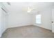 Bedroom featuring neutral walls, carpet flooring, ceiling fan, closet, and a window at 2637 Shelby Ruth Pl, St Cloud, FL 34769