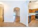 Open floor plan featuring kitchen with wood cabinets and stainless steel appliances and views to the living area at 2637 Shelby Ruth Pl, St Cloud, FL 34769