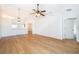 Spacious living room features wood floors, ceiling fan, and pendant lighting at 2637 Shelby Ruth Pl, St Cloud, FL 34769