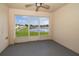 Enclosed patio offers serene lake views, perfect for relaxing and enjoying the picturesque surroundings at 2637 Shelby Ruth Pl, St Cloud, FL 34769