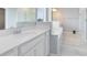 Luxurious bathroom with double sinks, soaking tub, and a separate glass-enclosed shower at 2661 Estuary Loop, Oviedo, FL 32765