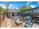 Charming backyard patio area with comfortable seating around a fire pit, adjacent to a refreshing pool area at 878 W Timberland Trl, Altamonte Springs, FL 32714