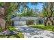 Charming single-story home featuring a spacious driveway and a well-manicured lawn at 878 W Timberland Trl, Altamonte Springs, FL 32714