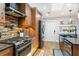 Beautiful kitchen with stainless steel appliances, stylish cabinets, and unique pot rack; features an eat-in kitchen at 878 W Timberland Trl, Altamonte Springs, FL 32714
