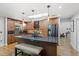 Spacious kitchen with a large island, stainless steel appliances, ample wood cabinets, and stylish pendant lighting at 878 W Timberland Trl, Altamonte Springs, FL 32714