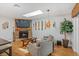 Bright living room with a skylight, stone fireplace, and unique African-themed art and decorations at 878 W Timberland Trl, Altamonte Springs, FL 32714
