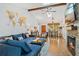 Inviting living room features wood beams, fireplace, hardwood floors, and a unique world map wall decoration at 878 W Timberland Trl, Altamonte Springs, FL 32714