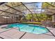 Screened-in pool with a spa, patio area, and lush backyard at 878 W Timberland Trl, Altamonte Springs, FL 32714