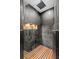 Walk-in shower with black tiling, wooden floor, and built-in niche at 878 W Timberland Trl, Altamonte Springs, FL 32714