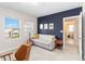 Cozy bedroom featuring modern decor, a comfortable daybed, and plentiful natural light at 12805 Charmed Dr, Winter Garden, FL 34787