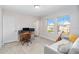 Comfortable bedroom featuring a neat desk, and large windows offering neighborhood views at 12805 Charmed Dr, Winter Garden, FL 34787