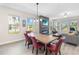 Cozy dining area in an open-concept living space with a modern fireplace feature wall at 12805 Charmed Dr, Winter Garden, FL 34787