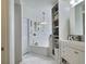 Bright bathroom featuring a large tub and shelving for storage at 1309 Rebecca Dr, Haines City, FL 33844