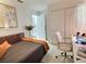 Comfortable bedroom with a dedicated workspace and a closet at 1309 Rebecca Dr, Haines City, FL 33844