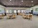 Large dining area with tables, chairs, and elegant carpeting at 1309 Rebecca Dr, Haines City, FL 33844