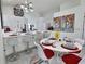 Well-lit kitchen and breakfast nook with a large island, stainless steel appliances, and modern finishes at 1309 Rebecca Dr, Haines City, FL 33844