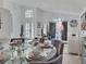 Bright living room with large windows, neutral decor, and views of dining area at 1309 Rebecca Dr, Haines City, FL 33844
