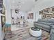Open living space with stylish decor, art, and comfortable gray seating at 1309 Rebecca Dr, Haines City, FL 33844
