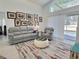 Cozy living room with comfortable seating, Gathering photos, and sliding doors to backyard at 1309 Rebecca Dr, Haines City, FL 33844