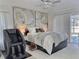 A relaxing main bedroom with pool access, stylish fan, and massage chair at 1309 Rebecca Dr, Haines City, FL 33844