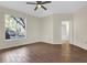 Bedroom featuring wood-look tile flooring, a window and ceiling fan at 1321 Arbor Vista Loop # 101, Lake Mary, FL 32746