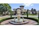 Stunning property featuring decorative fountain and manicured landscaping at 1321 Arbor Vista Loop # 101, Lake Mary, FL 32746