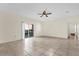 Living room with tile floors, ceiling fan, sliding glass door, and neutral paint at 1321 Arbor Vista Loop # 101, Lake Mary, FL 32746