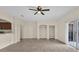 Open living area with kitchen bar, built-in shelves, tile floors, and natural light at 1321 Arbor Vista Loop # 101, Lake Mary, FL 32746