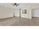 Spacious living room with tile flooring, modern ceiling fan, and open floor plan at 1321 Arbor Vista Loop # 101, Lake Mary, FL 32746