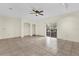 Neutral living area with tile flooring, built-in shelves, and sliding glass door at 1321 Arbor Vista Loop # 101, Lake Mary, FL 32746