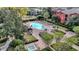 Aerial view of community pool and lounge area near community buildings at 1321 Arbor Vista Loop # 101, Lake Mary, FL 32746