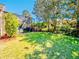 This backyard offers a lush lawn and a screened-in patio, perfect for outdoor relaxation and entertainment at 1450 Chessington Cir, Lake Mary, FL 32746
